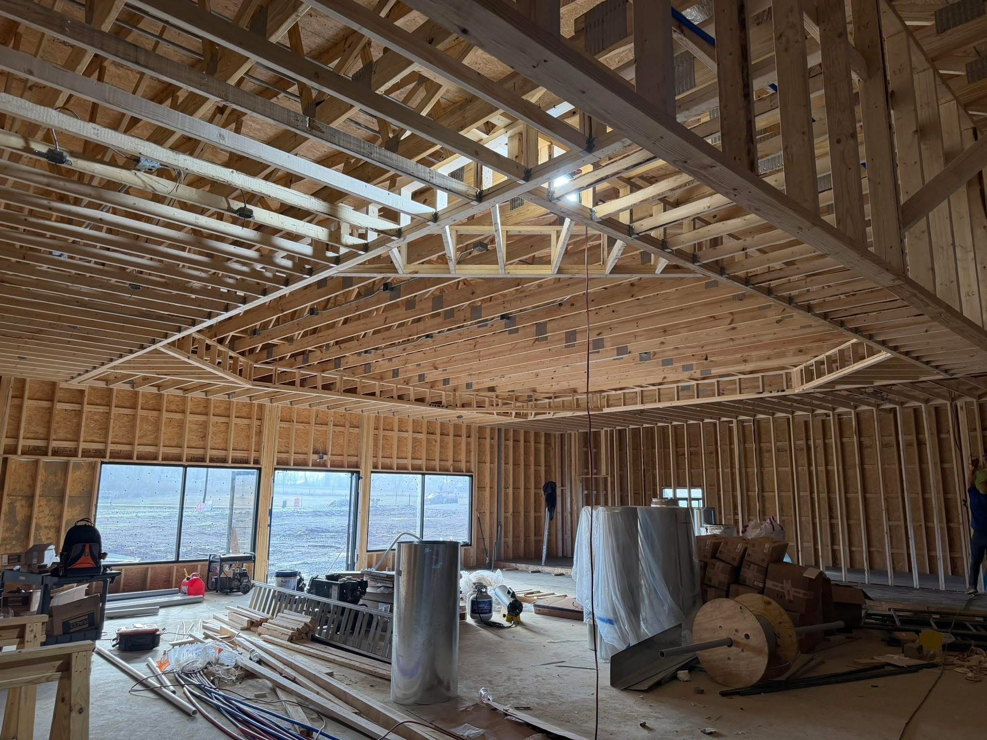 Interior wall and ceiling framing with rough-in wiring on a new home build