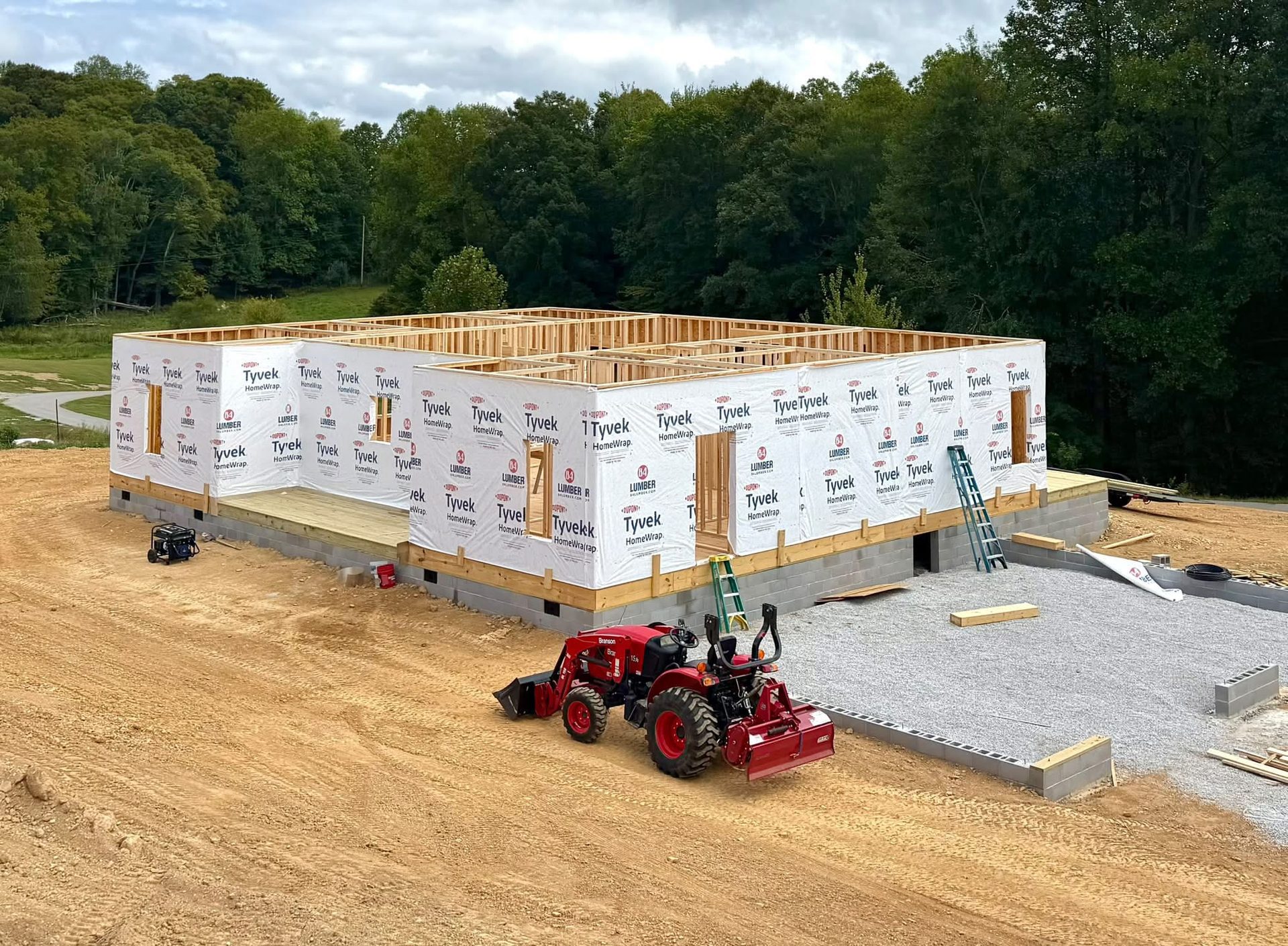 New home construction wall framing with house wrap, Adams Construction LLC
